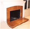 Travertine Tile Face Fireplace and raised hearth - custom wood mantel and surround