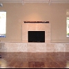 Travertine Tile Face Fireplace with raised hearth