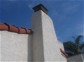Spanish style stucco chimney