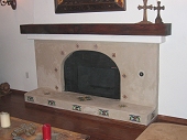 Tile face fireplace and hearth with wood mantle