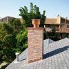 Custom Masonry Brick Chimney with copper chase cover and spark arrestor