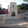Custom Masonry Outdoor Stucco Fireplace - BBQ and Fridge