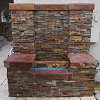 Outdoor True Stone Gas Fireplace Wall with blue fire glass