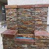 Outdoor True Stone Gas Fireplace Wall with blue fire glass
