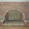 Brick Fireplace with arch and raised hearth