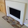 Simple Plaster Fireplace with tile hearth